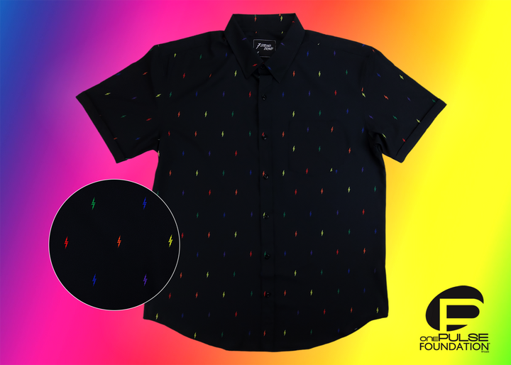 Full view of short sleeve adult button down shirt, black as base color and adorned with multicolored version of our 7-Bolt design. Shirt is on a multicolor gradient-like background, in the left corner there is a circled out close up of the colored 7-bolts and on the bottom right, the logo for onePULSE Foundation, our cause collection partner. 