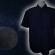 Load image into Gallery viewer, Full view of the short-sleeve Stargazer button down shirt. A deep navy blue shirt with constellation star patterns throughout. The shirt is displayed against a night sky full of stars. Bottom left corner shows a detail circle showcasing the constellation design.
