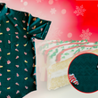 Load image into Gallery viewer, 3/4 full view of the 7-Strong &quot;Oh, Christmas Treat&quot; shirt - a green, christmas sweater-like background with columns of various white Christmas tree shaped cakes with red garland, some whole, some bitten. The shirt is displayed against a red, snowing background with a similar parted cake. Bottom right shows a detail circle highlighting the subtle shirt design. 
