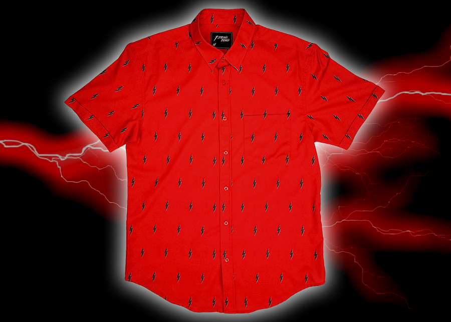 Full view of the 7-Strong Red 7-Bolt short sleeve shirt, featuring black 7-bolts with a white drop shadow interspersed on a red background. The shirt is featured on a red lightning storm backdrop.