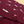 Load image into Gallery viewer, Mid drift button view of the adult 7-Strong &quot;Pour Decisions&quot; button up - deep red in color with various shaped and colored wine bottles patterned throughout in varying directions. Shirt is displayed against a sepia toned vineyard background. 
