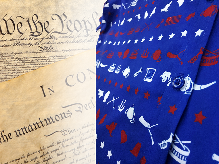 A close up representation of 7-Strong's 1776 button down shirt, in the middle button region, against a Declaration of Independence background. Shirt is royal blue with stripes of various Americana icons, including the original 13 colonies and revolutionary war items.