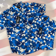 Load image into Gallery viewer, Full view close up of the 7-Strong &quot;Service Stars&quot; Adult and youth button-ups overlapping each other, featuring blue and creme colored camouflage with white weathered stars throughout. The shirt is featured against a waving U.S. Flag faded into the background. Bottom right is the 22 Flag Co logo.
