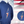 Load image into Gallery viewer, Full view of the navy blue Freedom Bolt hoodie, featured on a mannequin and showcasing a gold outlined 7-bolt with white stars on blue on top and red and white stripes on the bottom. The hoodie is featured on an American flag background. There is a detail circle in the bottom right circle featuring the 7-Bolt on the hoodie. 
