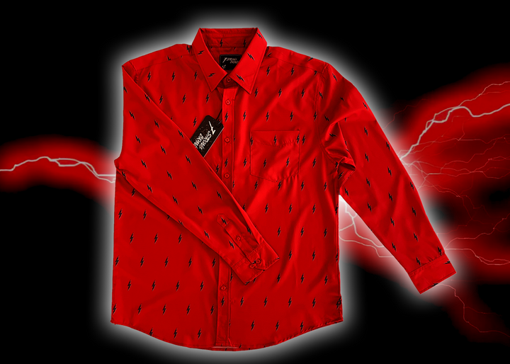 Full view of the 7-Strong Red 7-Bolt long sleeve shirt, featuring black 7-bolts with a white drop shadow interspersed on a red background. The shirt is featured on a red lightning storm backdrop.