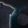 Load image into Gallery viewer, 3/4 view of the youth short-sleeve Stargazer button down shirt. A deep navy blue shirt with constellation star patterns throughout. The shirt is displayed against a night sky full of stars. Bottom right corner shows a detail circle showcasing the constellation design.
