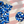 Load image into Gallery viewer, 3/4 Full view close up of the 7-Strong &quot;Service Stars&quot; youth button-up, featuring blue and creme colored camouflage with white weathered stars throughout. The shirt is featured against a waving U.S. Flag faded into the background. Top right is the 22 Flag Co logo, bottom left is a detail circle showing a close up of the camouflage and star design. 
