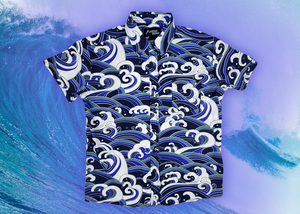 Full view of the 7-Strong "Let 'Er Riptipe" Youth button down shirt, featuring an array of indigo and purple waves with whitecaps all over. The shirt is featured against a purple tinted background of a wave cresting. 