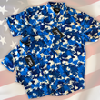 Load image into Gallery viewer, Full view close up of the 7-Strong &quot;Service Stars&quot; adult and youth button-ups overlapping each other, featuring blue and creme colored camouflage with white weathered stars throughout. The shirt is featured against a waving U.S. Flag faded into the background. Bottom right is the 22 Flag Co logo.
