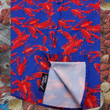 Load image into Gallery viewer, Close-up sweep tag view of the 7-Strong Dat Boil shirt in deep navy blue with red crawfish patterned throughout overlapping one another. The shirt itself sits on a background image of items from a Crawfish Boil such as crawfish, seasoning, corn, and potatoes. 
