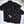 Load image into Gallery viewer, Full centered view of the youth and adult short sleeve versions of &quot;Got &#39;Em!,&quot; overlapping one another. The button down features various athletic fashion sneakers in an 80bit format arranged all over a black shirt. The shirt is featured against a background of a basketball player jumping in air, noticeable sneakers being worn. 
