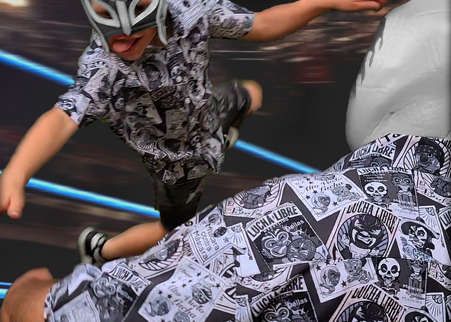 Action view of adult and youth model grappling like wrestlers wearing the youth and adult  7-Strong "Cinco de Mayhem" button down shirts. Shirt features black and white posters featuring various created luchadors advertised for matches, all overlapping each other over a black shirt. 